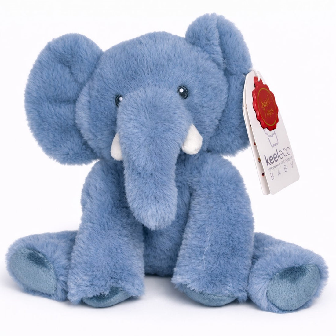 Blue plush elephant toy with a tag on a white background