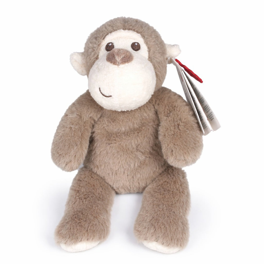 Plush monkey toy with a tag on a white background