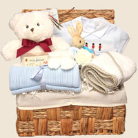 Luxury newborn baby gift hamper with teddy bear, soft blanket, baby clothes and wicker basket for baby shower gift