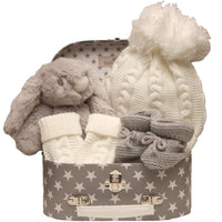 Baby Gift Set With Plush Bunny, Knitted Hat, And Booties In A Star-Patterned Box.