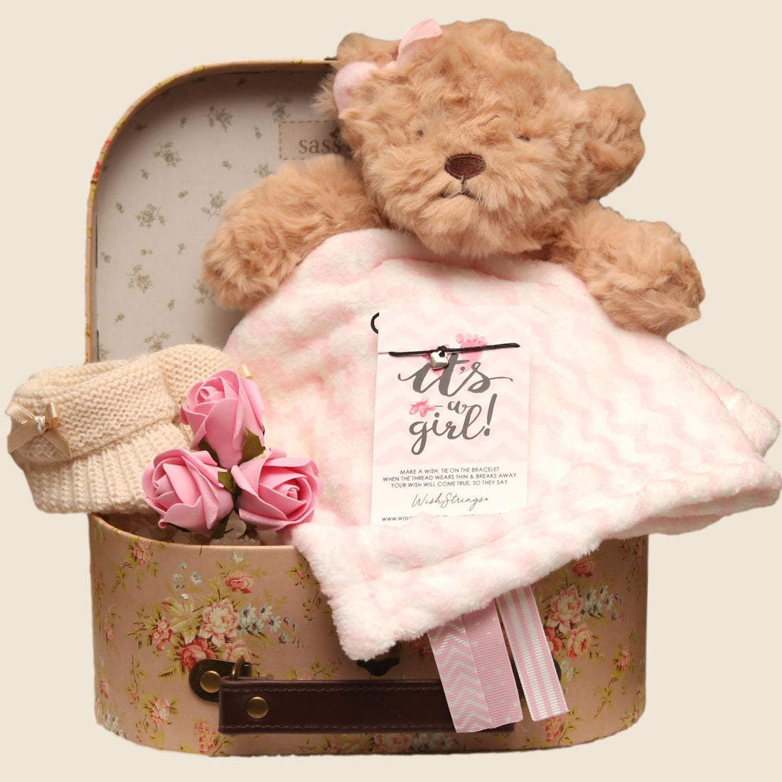 Baby girl gift hamper in floral keepsake suitcase, luxury newborn baby gift and baby shower present for new baby girl.