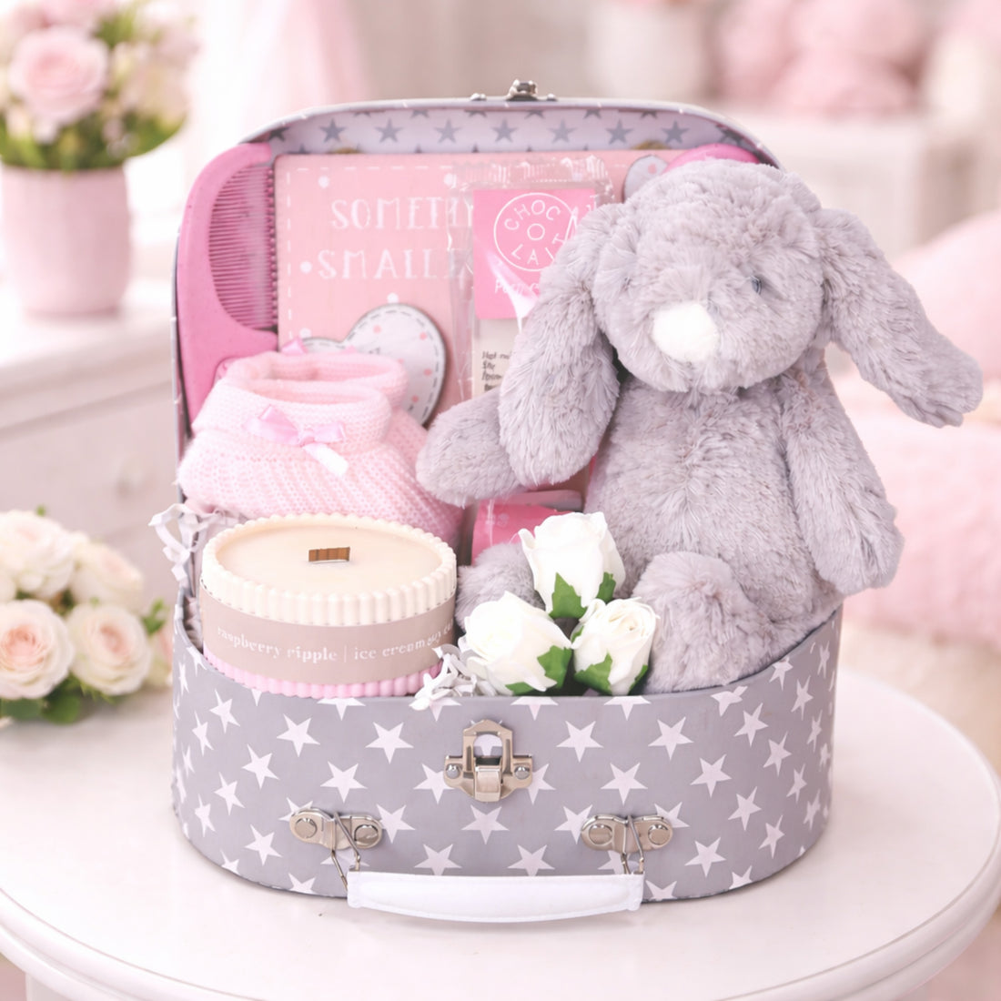 baby girl suitcase with gifts for new mum and baby