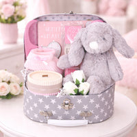 baby girl suitcase with gifts for new mum and baby