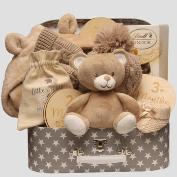 Beige Baby Suitcase Filled With Baby Essentials 